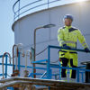 A Stena Oil employee standing on one of their oil tanks
